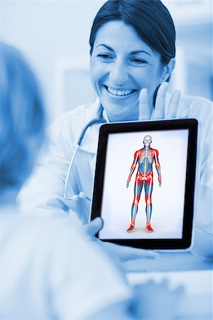 Smiling doctor showing a tablet computer to a child in hospital ward Stock Photo - Budget Royalty-Free & Subscription, Code: 400-06873499