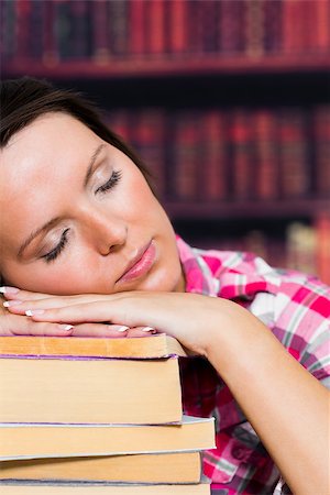 Girl sleeping on books in the library Stock Photo - Budget Royalty-Free & Subscription, Code: 400-06873568