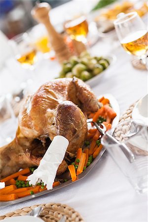 Delicious roast turkey dinner on table Stock Photo - Budget Royalty-Free & Subscription, Code: 400-06873651