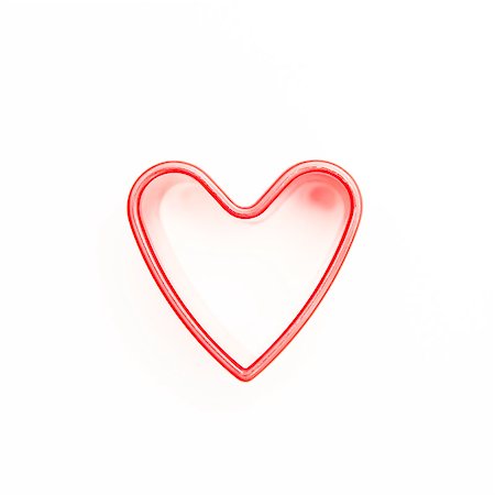 simsearch:400-06873734,k - Pink heart shaped cookie cutter on white background Stock Photo - Budget Royalty-Free & Subscription, Code: 400-06873687