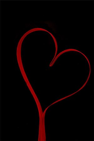 simsearch:400-06873734,k - Red heart shaped ribbon on black background Stock Photo - Budget Royalty-Free & Subscription, Code: 400-06873708