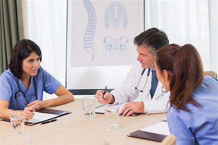 skeleton sitting down - Nurses and doctors in a meeting with skeleton diagram in background Stock Photo - Budget Royalty-Free & Subscription, Code: 400-06873739