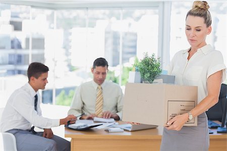 simsearch:6109-06781524,k - Businesswoman leaving office after being fired and carrying her belongings Stock Photo - Budget Royalty-Free & Subscription, Code: 400-06884074