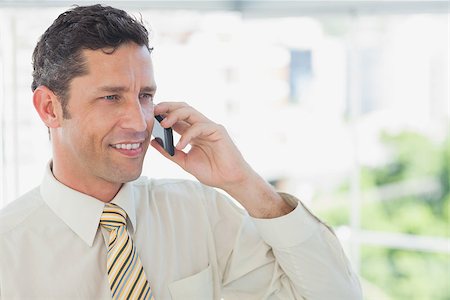 simsearch:400-07139155,k - Happy businessman on the phone in office Stock Photo - Budget Royalty-Free & Subscription, Code: 400-06884134