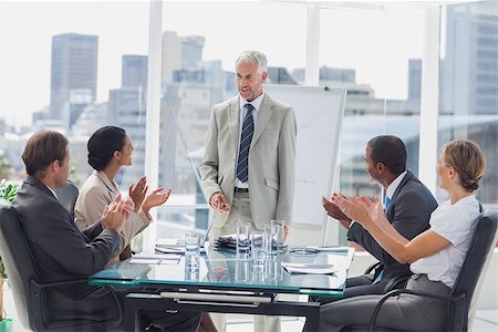 simsearch:400-06879262,k - Colleagues applauding the boss during a meeting in the meeting room Stock Photo - Budget Royalty-Free & Subscription, Code: 400-06884506