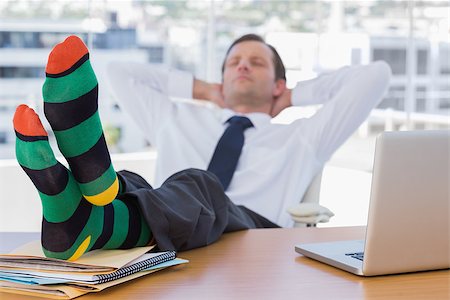 socks feet - Businessman sleeping with feet without shoes on his desk Stock Photo - Budget Royalty-Free & Subscription, Code: 400-06884545