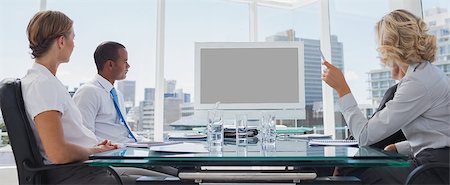 simsearch:400-06879262,k - Business people gathered during a video conference in the boardroom Stock Photo - Budget Royalty-Free & Subscription, Code: 400-06884555