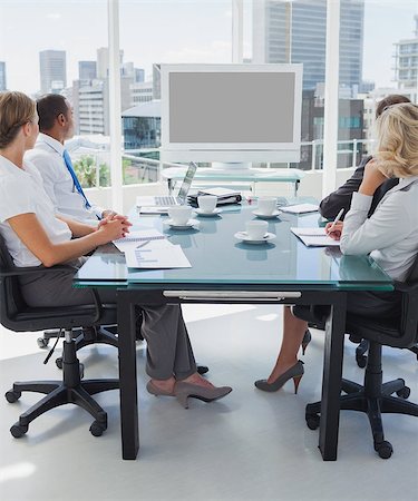 simsearch:400-06879262,k - Business people gathered for a video conference in the boardroom Stock Photo - Budget Royalty-Free & Subscription, Code: 400-06884557
