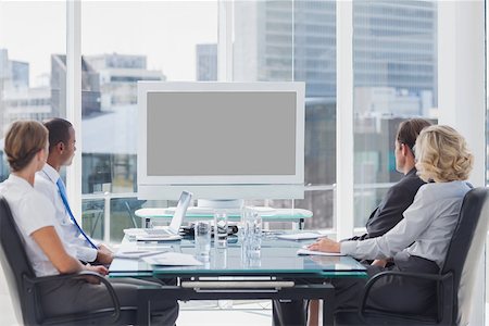 simsearch:400-06879262,k - Group of business people looking at a screen during a video conference Stock Photo - Budget Royalty-Free & Subscription, Code: 400-06884551