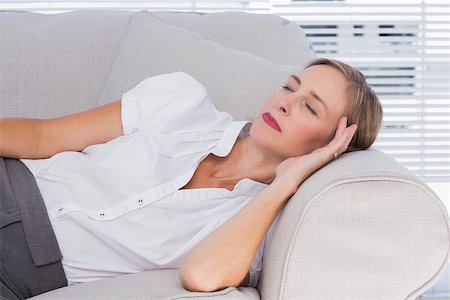 Businesswoman sleeping on couch in the office Stock Photo - Budget Royalty-Free & Subscription, Code: 400-06884717