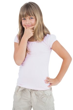 simsearch:400-06885115,k - Serious young girl looking at camera on white background Photographie de stock - Aubaine LD & Abonnement, Code: 400-06885038