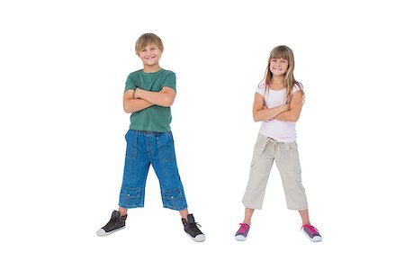 simsearch:400-06885115,k - Smiling children with their arms crossed on white background Photographie de stock - Aubaine LD & Abonnement, Code: 400-06885054