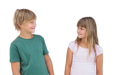 simsearch:400-06885104,k - Little girl and boy looking at each other and smiling on white background Stock Photo - Budget Royalty-Free & Subscription, Code: 400-06885053