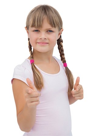 simsearch:400-06885115,k - Pretty little girl giving thumbs up on white background Photographie de stock - Aubaine LD & Abonnement, Code: 400-06885086