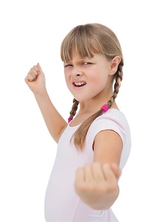 portrait screaming girl - Furious little girl showing her fist on white background Stock Photo - Budget Royalty-Free & Subscription, Code: 400-06885088