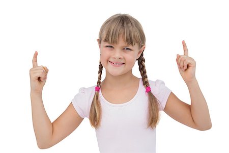 Happy young girl pointing up on white background Stock Photo - Budget Royalty-Free & Subscription, Code: 400-06885089