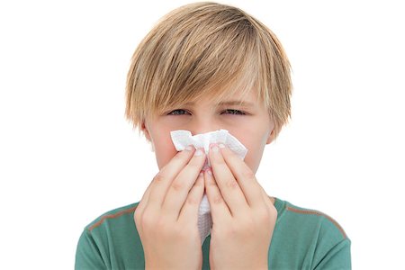 sneeze in her handkerchief - Sick little boy with a handkerchief on white background Stock Photo - Budget Royalty-Free & Subscription, Code: 400-06885097