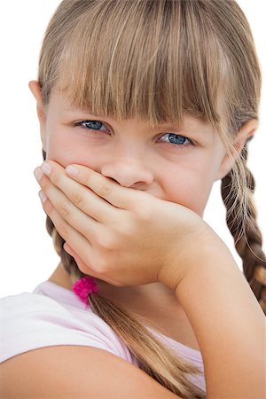 simsearch:400-06885115,k - Beautiful little girl with her hand on her mouth on white background Photographie de stock - Aubaine LD & Abonnement, Code: 400-06885099