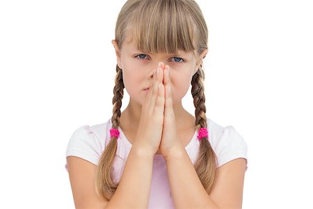 photos of little girl praying - Little girl with her hands on her face on white background Stock Photo - Budget Royalty-Free & Subscription, Code: 400-06885104