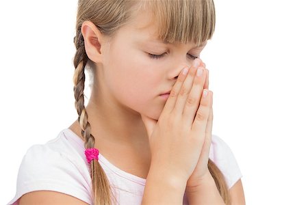 simsearch:400-06885115,k - Young girl praying on white background Photographie de stock - Aubaine LD & Abonnement, Code: 400-06885105