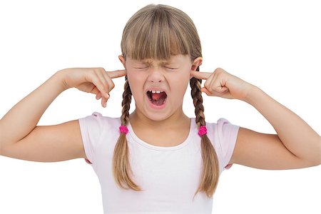 simsearch:400-06885104,k - Funny little girl clogging her ears and wincing on white background Stock Photo - Budget Royalty-Free & Subscription, Code: 400-06885108