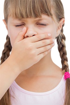 Little blond girl with her hand on her mouth with her eyes closed on white background Stock Photo - Budget Royalty-Free & Subscription, Code: 400-06885102