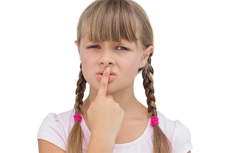 simsearch:400-06885115,k - Young girl with her finger on her mouth on white background Photographie de stock - Aubaine LD & Abonnement, Code: 400-06885103