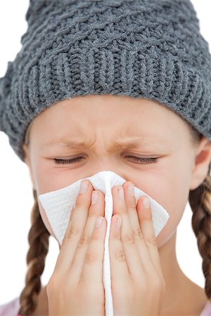 simsearch:400-06885115,k - Sick little girl with an handkerchief with eyes closed on white background Photographie de stock - Aubaine LD & Abonnement, Code: 400-06885113