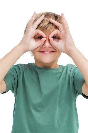 preteens fingering - Happy little guy making goggles with his fingers on white background Stock Photo - Budget Royalty-Free & Subscription, Code: 400-06885128