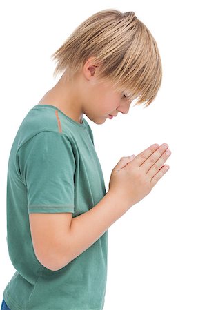 simsearch:400-06885104,k - Little boy praying with bowed head on white background Stock Photo - Budget Royalty-Free & Subscription, Code: 400-06885134