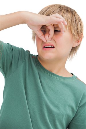 simsearch:400-05213670,k - Boy pinching his nose on white background Stock Photo - Budget Royalty-Free & Subscription, Code: 400-06885135