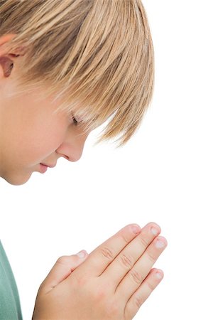simsearch:400-06885104,k - Little boy praying with eyes closed on white background Stock Photo - Budget Royalty-Free & Subscription, Code: 400-06885133