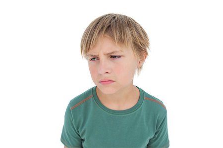 simsearch:400-06885104,k - Furious little boy looking down on white background Stock Photo - Budget Royalty-Free & Subscription, Code: 400-06885141