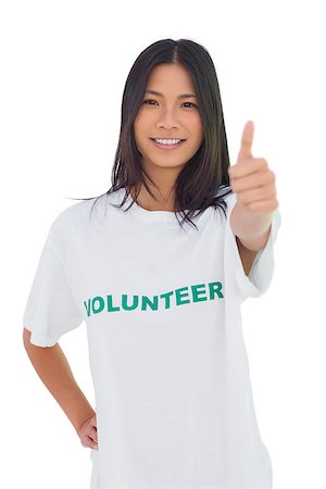 Cheerful volunteer woman with thumb up on white background Stockbilder - Microstock & Abonnement, Bildnummer: 400-06885155