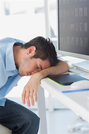 Graphic designer sleeping on his keyboard in his office Stock Photo - Budget Royalty-Free & Subscription, Code: 400-06885284