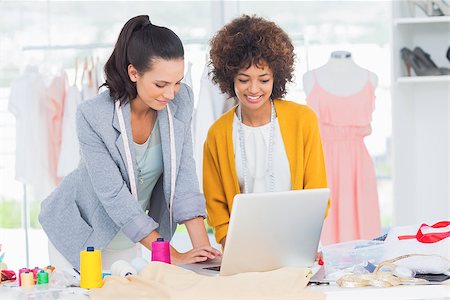 simsearch:400-06885526,k - Fashion designers working on a laptop in a creative office Stock Photo - Budget Royalty-Free & Subscription, Code: 400-06885593