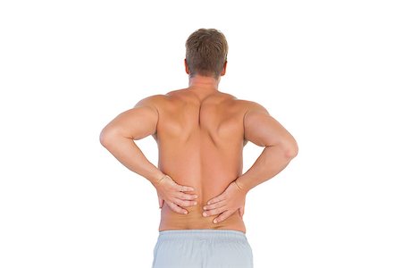 Shirtless man suffering from lower back pain on white background Photographie de stock - Aubaine LD & Abonnement, Code: 400-06885751