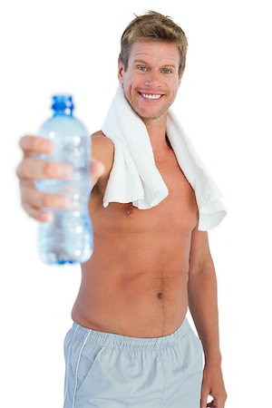 simsearch:400-06885881,k - Shirtless handsome man offering water on white background Photographie de stock - Aubaine LD & Abonnement, Code: 400-06885806