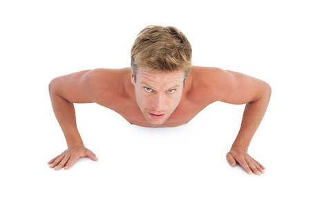 simsearch:400-06885881,k - Shirtless man doing push ups on white background Photographie de stock - Aubaine LD & Abonnement, Code: 400-06885835