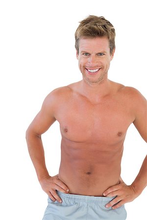 simsearch:400-06885881,k - Shirtless man with hands on hips on white background Photographie de stock - Aubaine LD & Abonnement, Code: 400-06885851