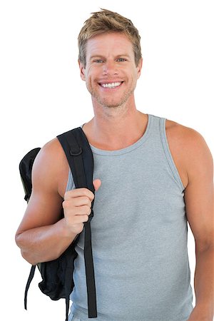 simsearch:400-06885881,k - Smiling man in sportswear holding backpack on white background Photographie de stock - Aubaine LD & Abonnement, Code: 400-06885868