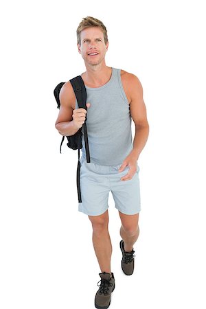 Handsome man walking and holding backpack on white background Stockbilder - Microstock & Abonnement, Bildnummer: 400-06885870