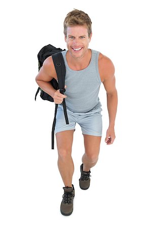 Cheerful man holding backpack on white background Stockbilder - Microstock & Abonnement, Bildnummer: 400-06885873