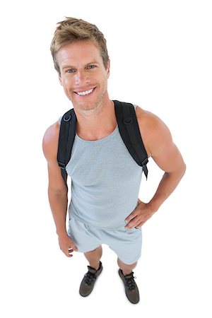 Attractive man in sportswear with hands on hips on white background Stockbilder - Microstock & Abonnement, Bildnummer: 400-06885881