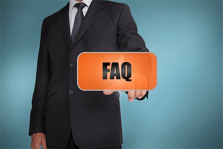 Businessman selecting orange tag with faq written on it on blue background Stock Photo - Budget Royalty-Free & Subscription, Code: 400-06885907