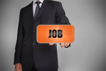 simsearch:400-06886051,k - Businessman touching orange tag with the word job written on it on grey background Stock Photo - Budget Royalty-Free & Subscription, Code: 400-06885946