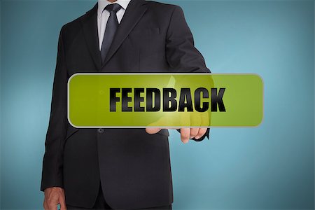 simsearch:400-06886798,k - Businessman touching the word feedback written on green tag on blue background Stock Photo - Budget Royalty-Free & Subscription, Code: 400-06885976