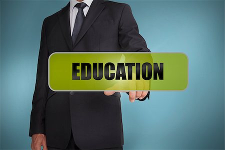 simsearch:400-06886806,k - Businessman touching the word education written on green tag on blue background Photographie de stock - Aubaine LD & Abonnement, Code: 400-06885984