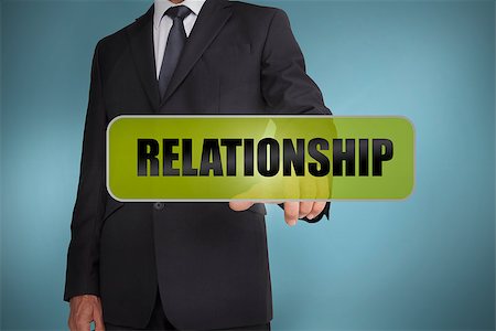 simsearch:400-06886798,k - Businessman touching the word relationship written on green tag on blue background Stock Photo - Budget Royalty-Free & Subscription, Code: 400-06885985