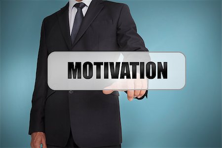 simsearch:400-06886798,k - Businessman selecting the word motivation written on white tag on blue background Stock Photo - Budget Royalty-Free & Subscription, Code: 400-06885986